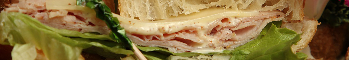 Eating Sandwich Bakery at Yalaha Bakery restaurant in Yalaha, FL.